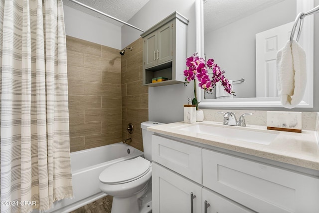 full bathroom with wood-type flooring, a textured ceiling, toilet, shower / tub combo with curtain, and vanity