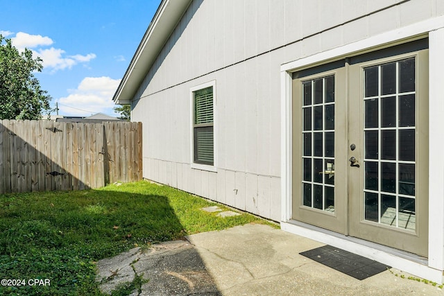 view of side of home with french doors