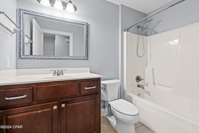 full bathroom featuring tile patterned floors, bathtub / shower combination, a textured ceiling, vanity, and toilet