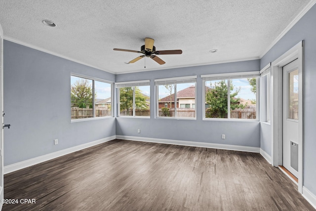 unfurnished sunroom with plenty of natural light and ceiling fan