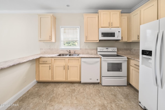 kitchen with white appliances, sink, and ornamental molding