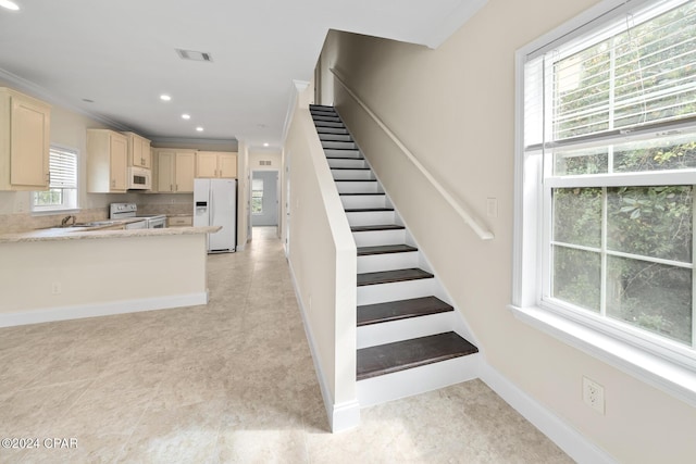 16246 E Lullwater, Panama City Beach, FL 32413 - staircase with recessed lighting, baseboards, ornamental molding, and tile patterned flooring