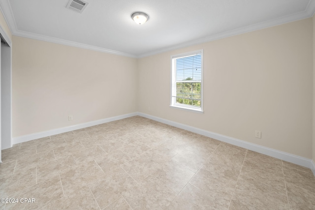 unfurnished room featuring ornamental molding