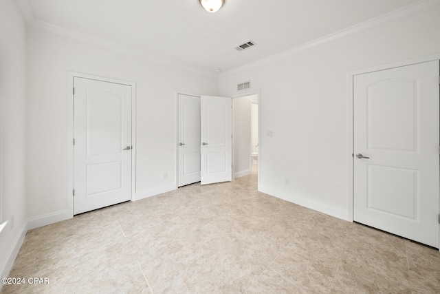 unfurnished bedroom featuring ornamental molding