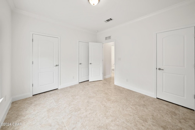16246 E Lullwater, Panama City Beach, FL 32413 - unfurnished bedroom with crown molding, multiple closets, and baseboards