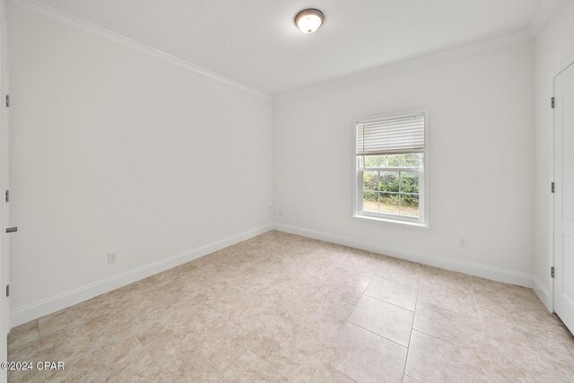 16246 E Lullwater, Panama City Beach, FL 32413 - empty room featuring ornamental molding, baseboards, and light tile patterned flooring
