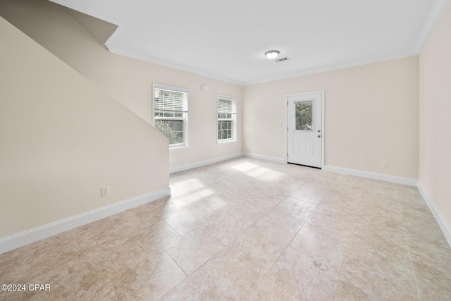 16246 E Lullwater, Panama City Beach, FL 32413 - empty room featuring ornamental molding, light tile patterned floors, and baseboards