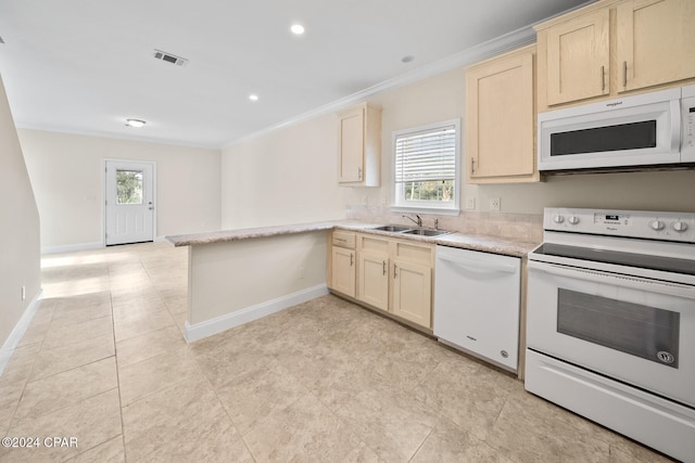 kitchen with white appliances, sink, kitchen peninsula, and ornamental molding