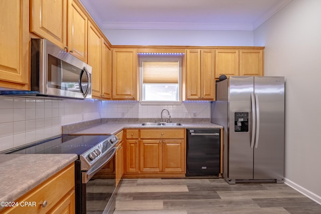 bedroom with ceiling fan, light hardwood / wood-style floors, and separate washer and dryer