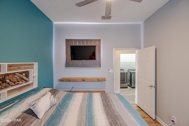 bedroom with hardwood / wood-style flooring, ceiling fan, and a closet