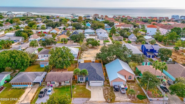 drone / aerial view with a water view and a view of the beach