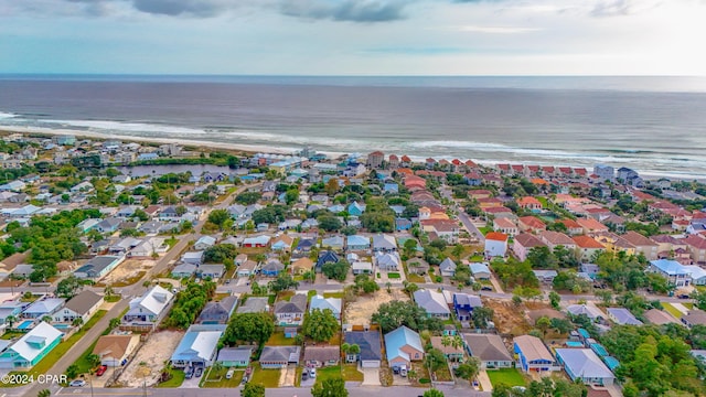 birds eye view of property featuring a water view and a view of the beach