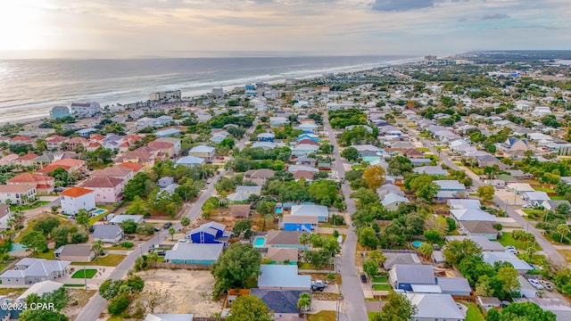 aerial view at dusk with a water view