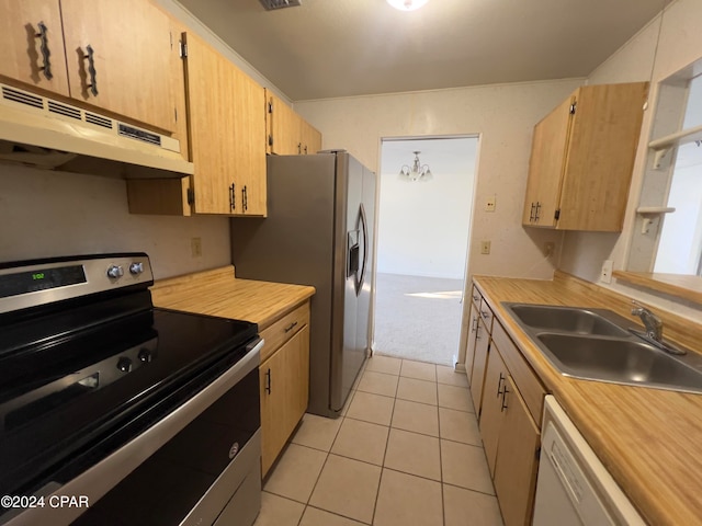 kitchen with sink, light brown cabinets, a notable chandelier, light tile patterned flooring, and appliances with stainless steel finishes