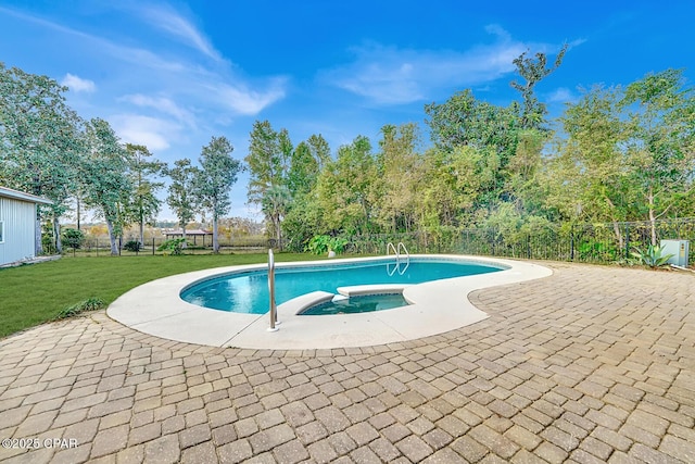 view of swimming pool featuring an in ground hot tub, a patio, and a lawn