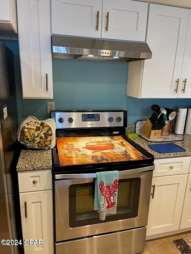 kitchen with electric range, white cabinets, and exhaust hood