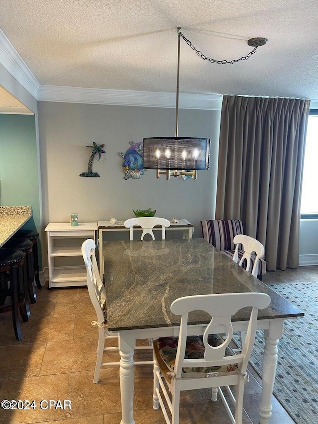 dining space with a textured ceiling and ornamental molding