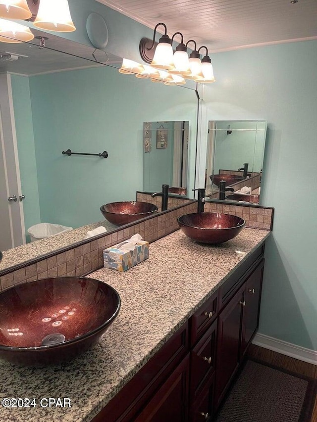 bathroom with vanity and hardwood / wood-style flooring