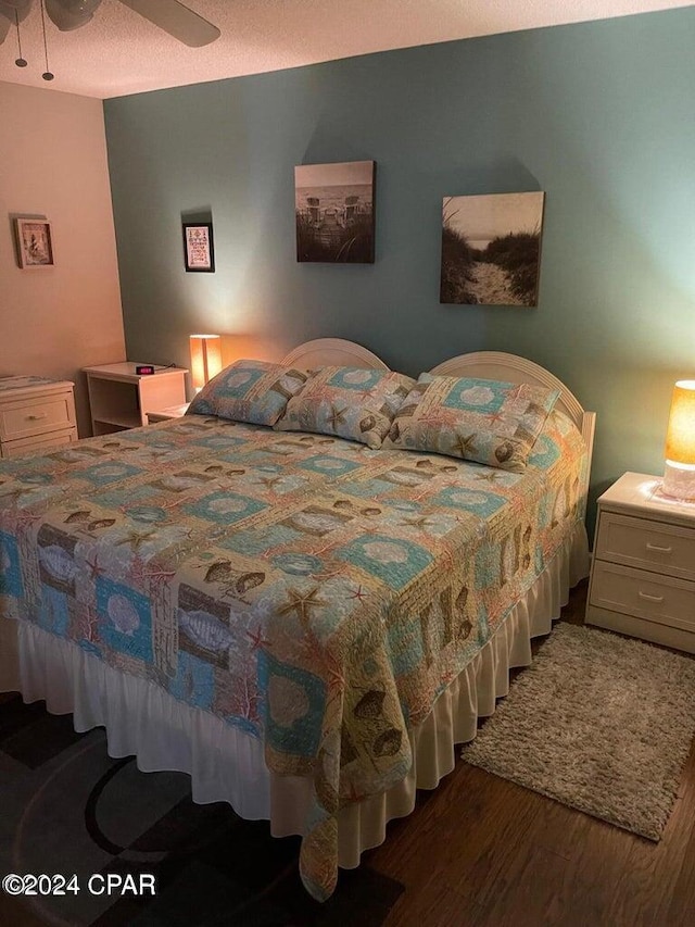 bedroom with hardwood / wood-style flooring and ceiling fan