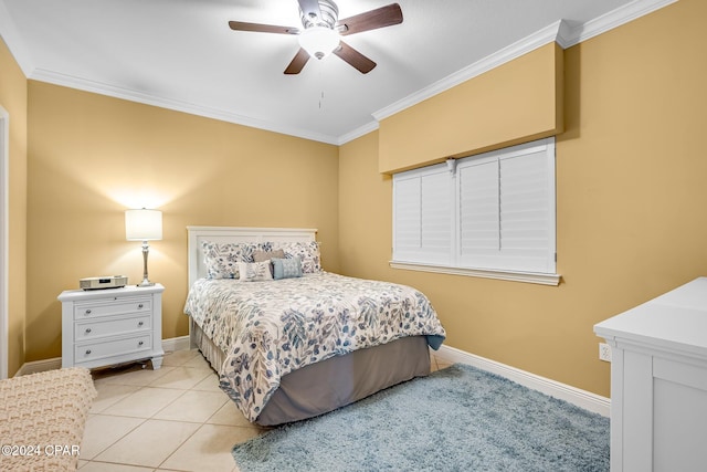 tiled bedroom featuring ornamental molding and ceiling fan