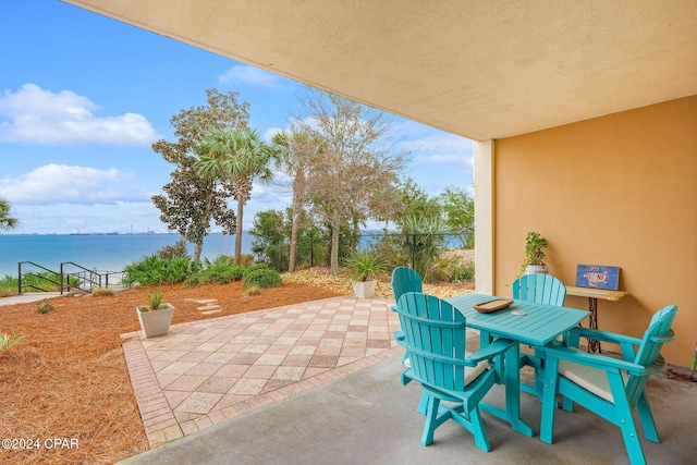 view of patio / terrace with a water view