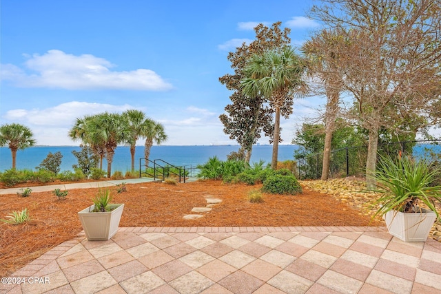 view of patio featuring a water view