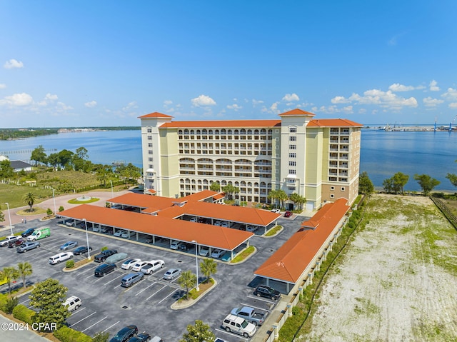 birds eye view of property with a water view