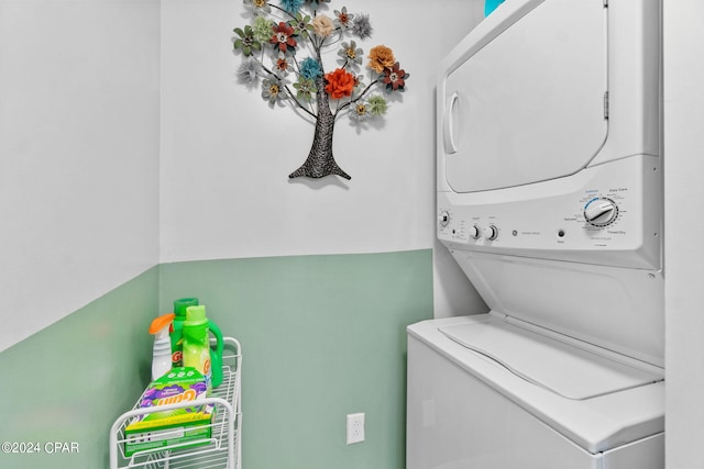 laundry room featuring stacked washing maching and dryer