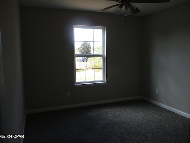 carpeted empty room with plenty of natural light and ceiling fan