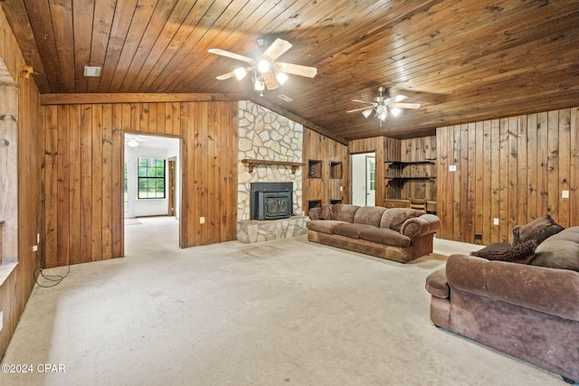 carpeted living room with lofted ceiling, wooden walls, ceiling fan, and wooden ceiling