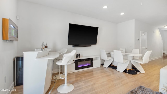 living room with light hardwood / wood-style flooring