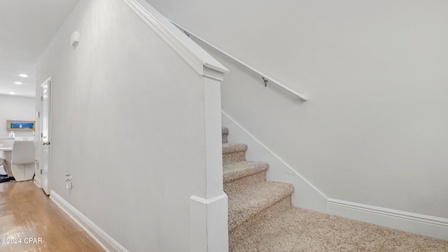 staircase featuring hardwood / wood-style flooring