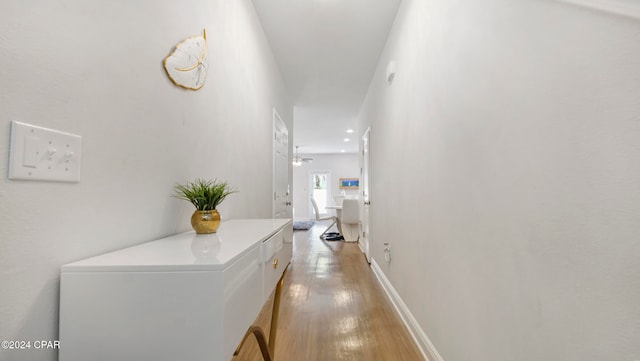 hallway with light wood-type flooring