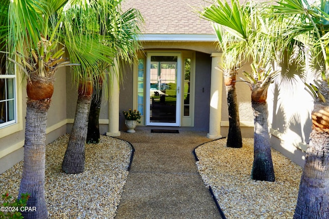 entrance to property featuring a patio