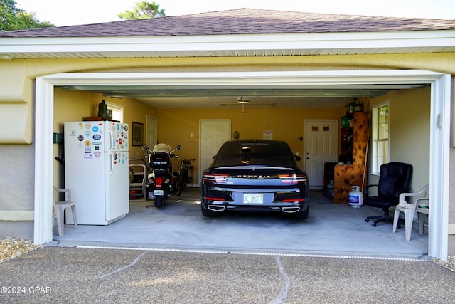 garage featuring white fridge