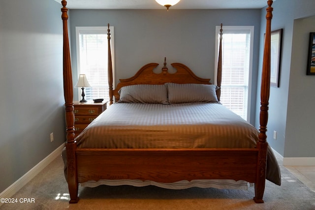 bedroom featuring light carpet