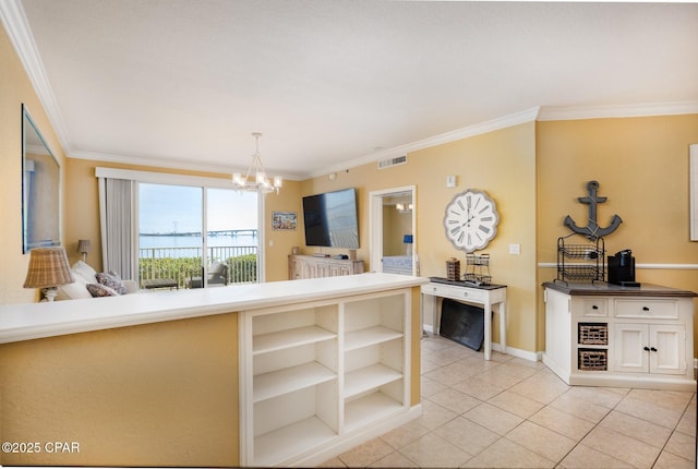 kitchen featuring pendant lighting, crown molding, light tile patterned floors, and a notable chandelier