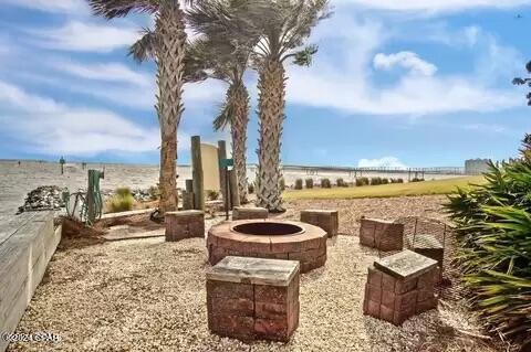 view of yard with an outdoor fire pit