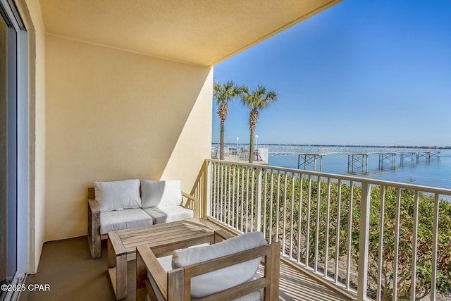 balcony featuring a water view