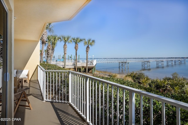 balcony featuring a water view