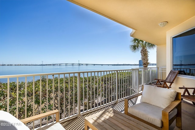 balcony featuring a water view