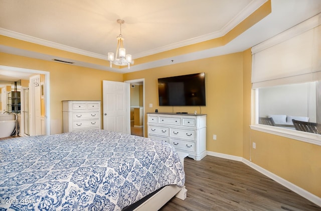 bedroom featuring crown molding, dark wood-type flooring, an inviting chandelier, and a tray ceiling