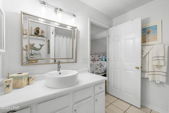 bathroom with tile patterned flooring and vanity