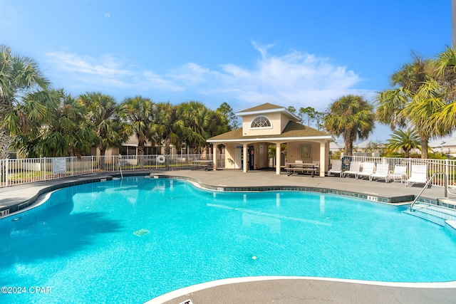 view of swimming pool featuring a patio area