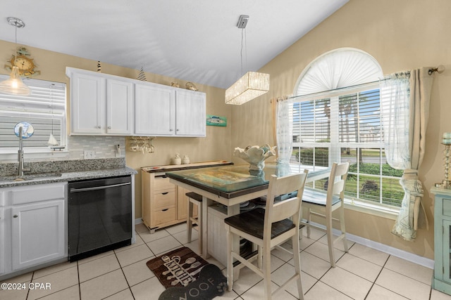 kitchen featuring pendant lighting, dishwasher, white cabinets, and sink