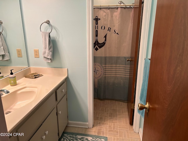 bathroom with vanity and walk in shower