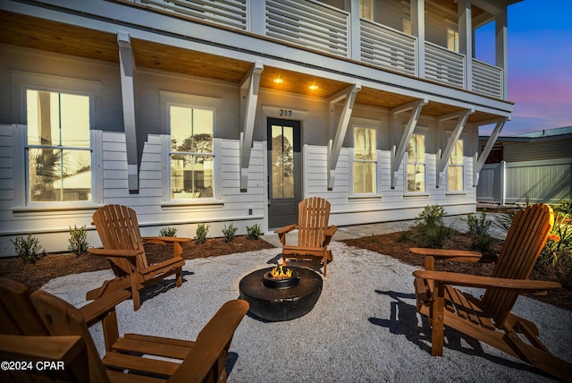 patio terrace at dusk with an outdoor fire pit