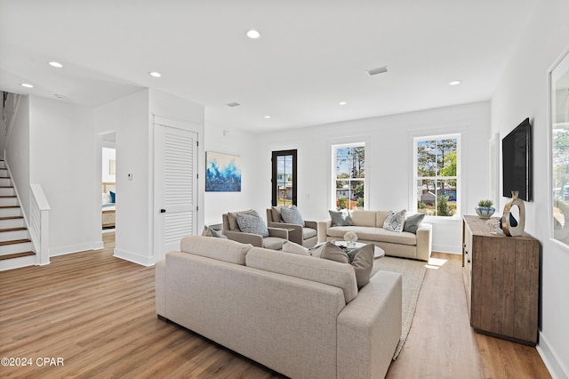 living room with light hardwood / wood-style floors