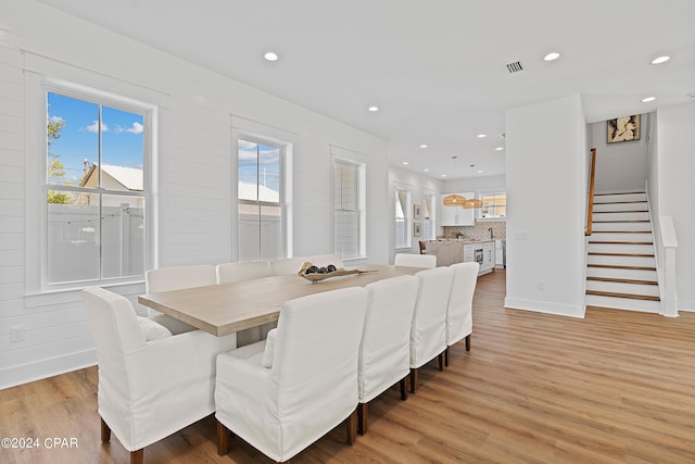 dining area with light hardwood / wood-style flooring