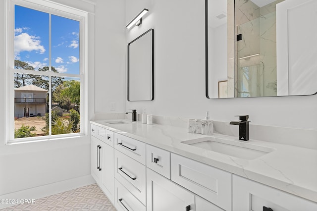 bathroom with vanity and a shower with shower door